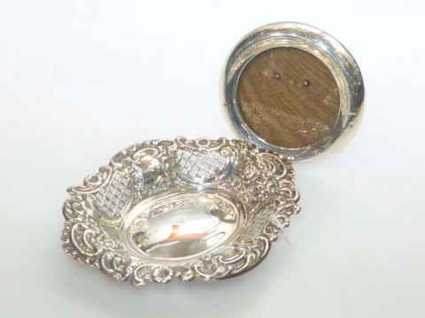 Small circular silver photograph frame and embossed and pierced silver...