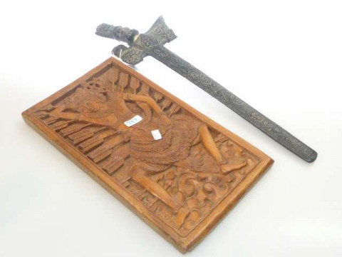 Indonesian carving of the Martyrdom of St. Sebastian and Indonesian Kris