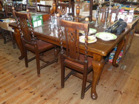 Early 20th Century oak extending dining table on cabriole legs with two...