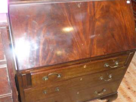 Mahogany three drawer bureau on ball and claw legs