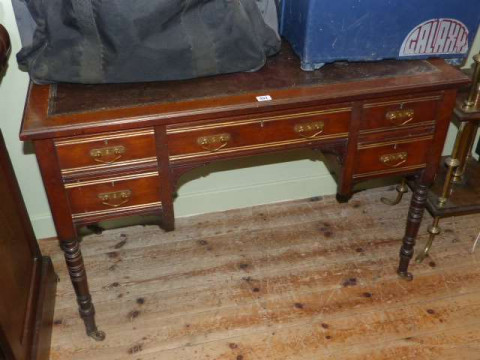 Late 19th Century mahogany five drawer writing table on ring turned legs...