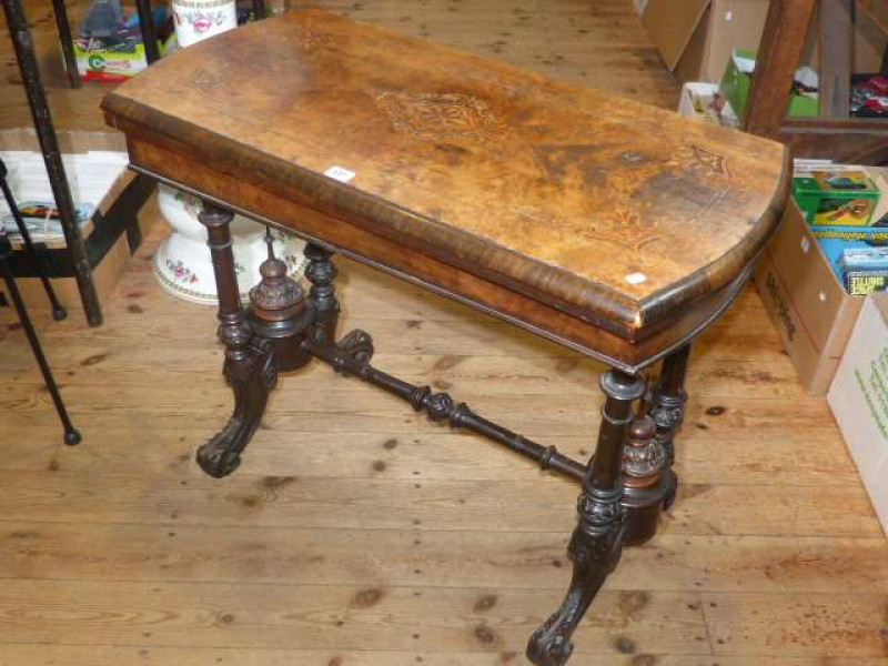 Victorian walnut and satinwood inlaid rectangular fold top card table on four turned pillars to carved splayed legs