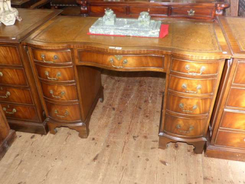 Bevan Funnell Ltd nine drawer serpentine front pedestal desk