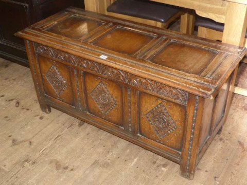 Carved oak triple panel front coffer