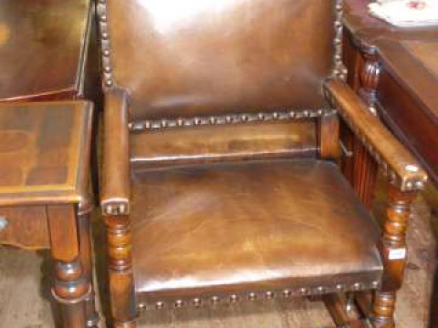 Pair of oak and studded hide elbow chairs