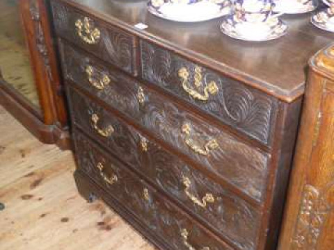 19th Century carved oak chest of two short above three long drawers on...