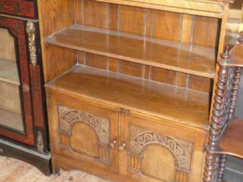 Carved oak open two door cabinet bookcase bearing label for Maple Co