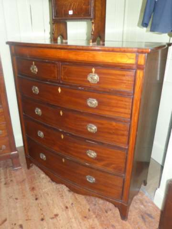19th Century inlaid mahogany bow front chest of two short above four long drawers on splayed bracket feet