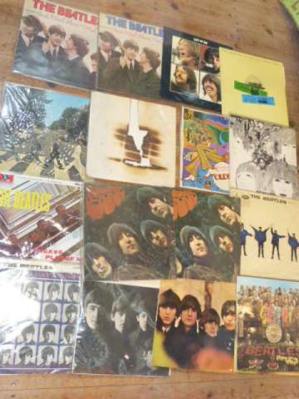 Sixteen Beatles albums including Revolver, Let it be, Please Please Me, A Hard Days Night, etc
