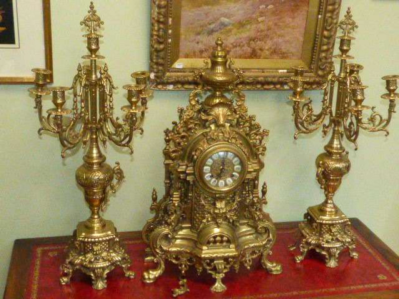 Ornate gilt metal clock garniture