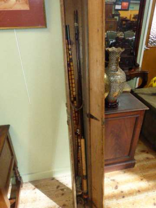 Two vintage fishing rods in wooden case