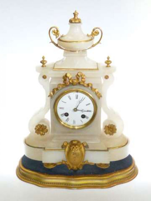 Ornate Alabaster and gilt metal Victorian mantel clock on gilt wood plinth