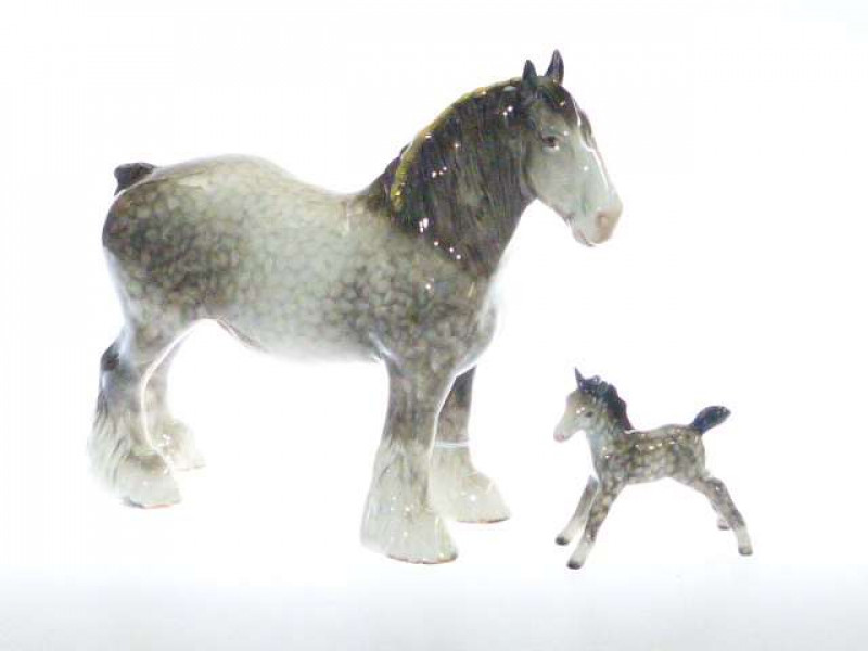 Beswick model of s Shire Horse, no. 818, rocking horse grey; and a Beswick model of a stretched foal, no. 836, rocking horse grey (2)