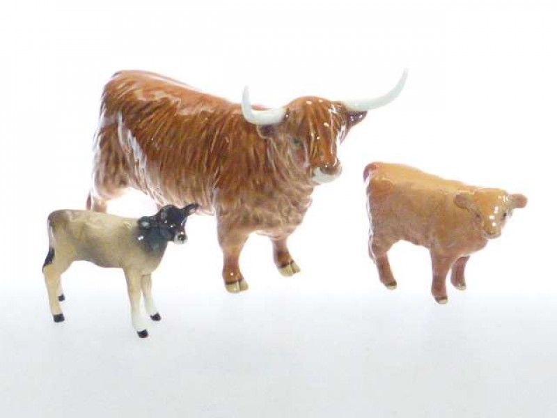 Beswick model of a Highland Cow, no. 1740; Beswick model of a Highland Calf, no. 1827D; and a Beswick model of a Jersey Calf, 1249D (3)
