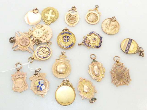 Collection of nineteen 9ct gold fobs, approximately 132 grams in total