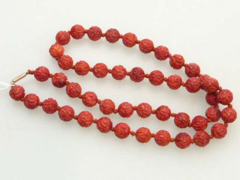 String of red coloured uniform beads, approximately 38 grams
