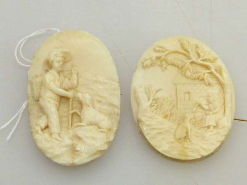 Two Dieppe carved ivory brooches, approximately 25 grams in total