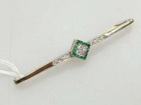 Emerald and diamond bar brooch, stamped 18, 6cm