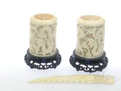 Pair of Chinese carved and pierced ivory vases, c.1900; and a letter knife...
