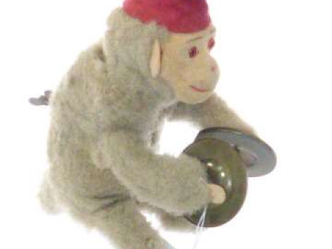 Vintage clockwork monkey playing cymbals