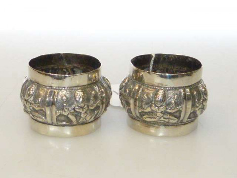 Pair embossed white metal napkin rings