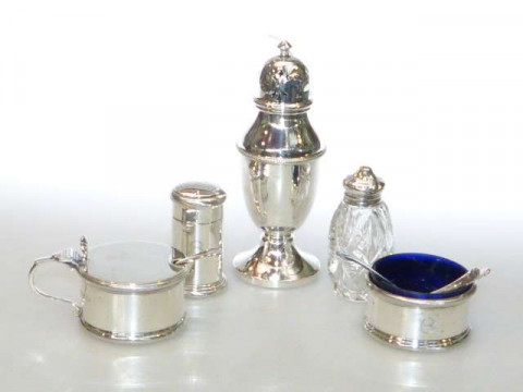 Silver lidded mustard and open salt with spoons, silver caster, pepperette...