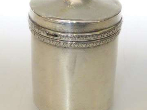 Silver engine turned cylindrical cigarette dispenser with spring loaded...