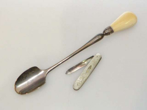 George III silver cheese scoop and silver and mother of pearl folding...