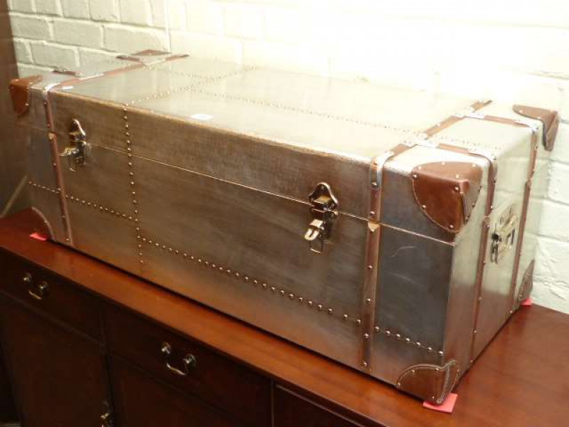As new polished metal, leather and wood bound cabin trunk
