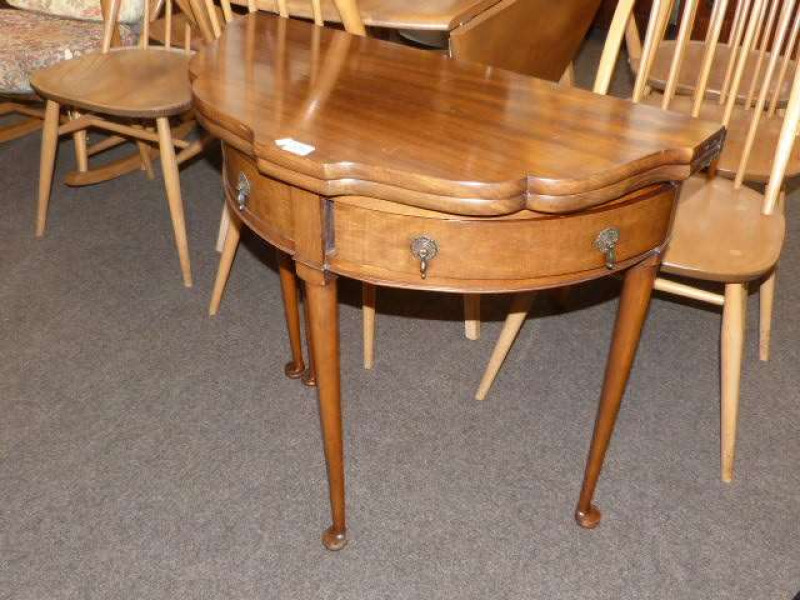 Mahogany shaped front fold top card table on pad feet