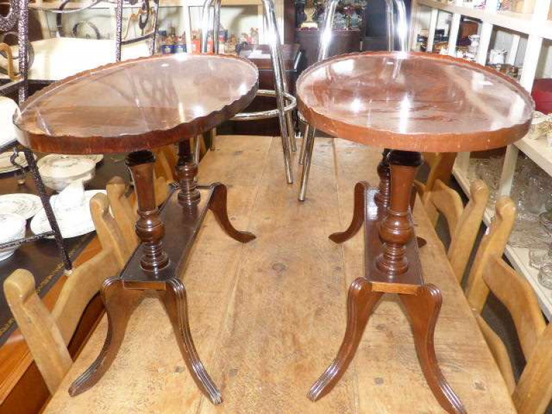 Pair oval mahogany twin pedestal coffee tables
