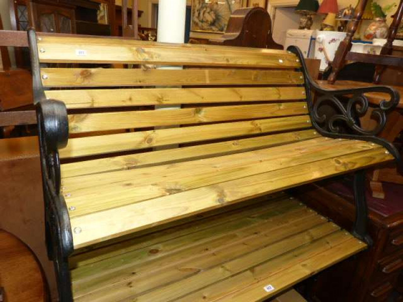 Wrought iron and stained wood garden bench
