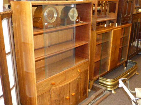 Two similar walnut sliding glazed door cabinets
