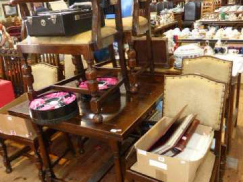 Oak draw leaf dining table and six panel back dining chairs