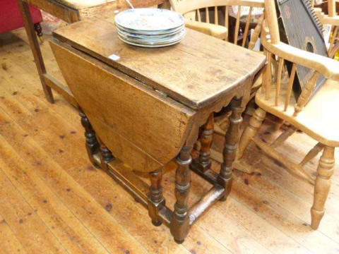 Period style small jointed oak drop leaf table