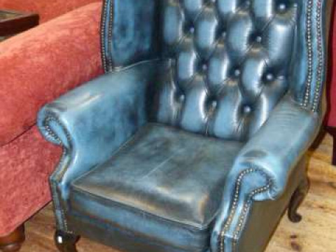 Pair blue leather deep buttoned back wing easy chairs on cabriole legs