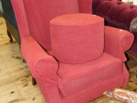 Pair wing easy chairs and circular footstool in red fabric