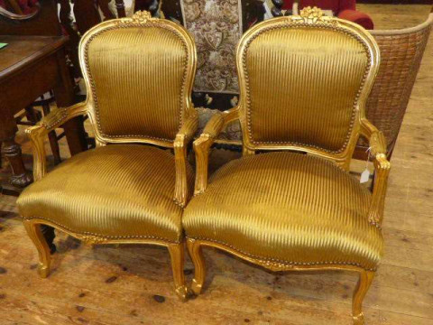 Pair gilt framed panel back fauteuils in gold striped fabric