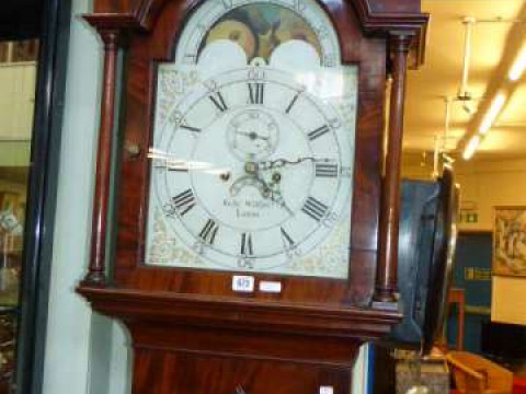 Antique mahogany eight day longcase clock having arched moon phase dial...