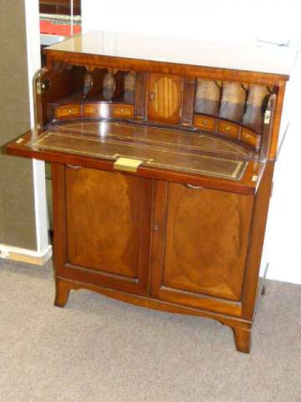 George III style mahogany secretaire cabinet, the fall front above two cupboard doors on splayed bracket feet