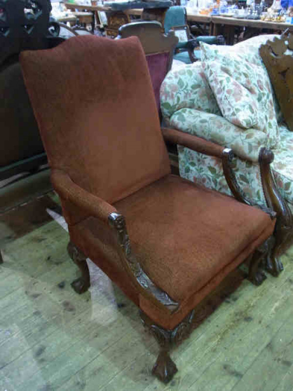 Victorian Style Carved Mahogany Elbow Chair on ball and claw feet, in rust fabric