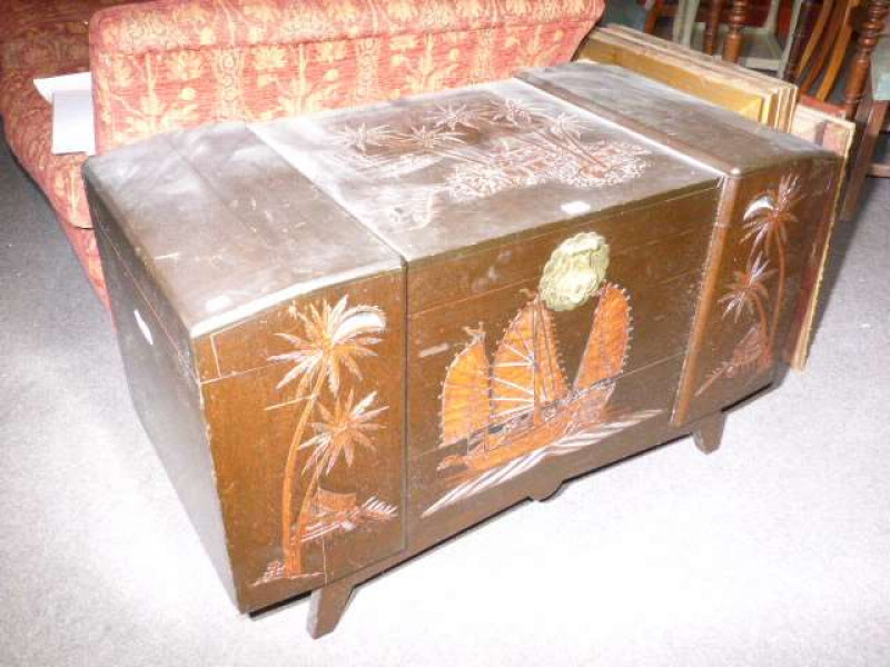 Carved camphorwood trunk and seven pictures