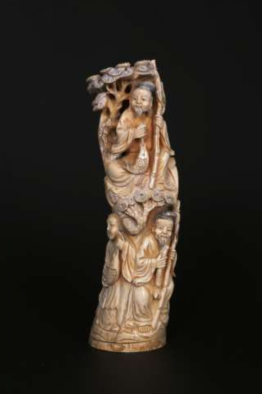 A CHINESE IVORY TUSK CARVING 19th Century Carved with three fishermen and foliage, signed. 25cm