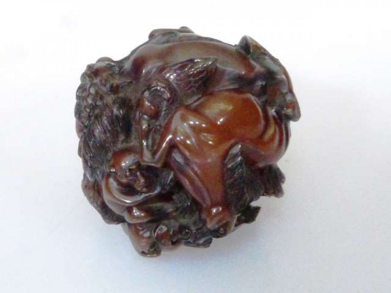 A CHINESE AMBER-COLOURED ZODIAC BALL Decorated with animals, signed. 5cm