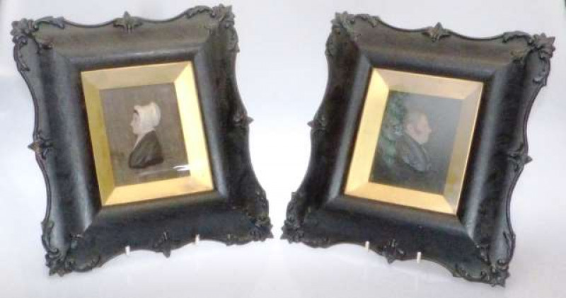 A PAIR OF WAX PORTRAITS 19th Century A lady and gentleman, in carved frames. Overall 30.5cm by 28cm
