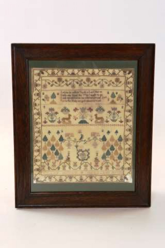 A GEORGIAN SAMPLER Signed Isabella Munro - June 1812 Worked with the names William Munro and Margaret Munro, framed. Overall 52.5cm by 44cm