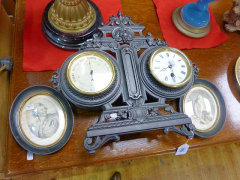 Barometer and clock in ornate cast metal frame and two oval portraits...