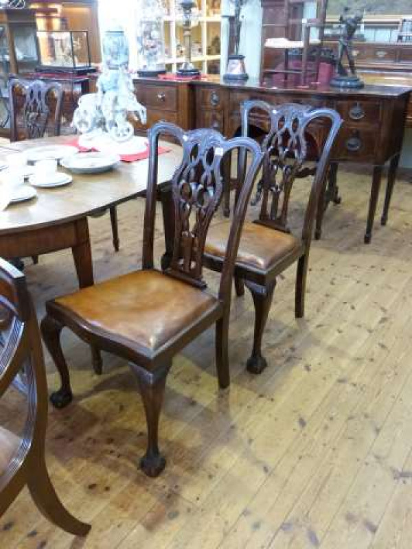 Set of four Chippendale style mahogany dining chairs on ball and claw legs