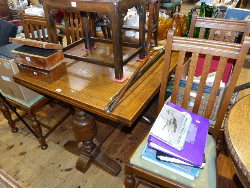 Oak draw leaf dining table and four chairs