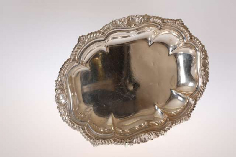 A GEORGE IV SILVER VEGETABLE DISH, William Ker Reid, London 1827, of lobed rectangular form, the rim cast with gadrooning and acanthus, engraved with a crest. 32.5oz, 32.5cm by 24.5cm